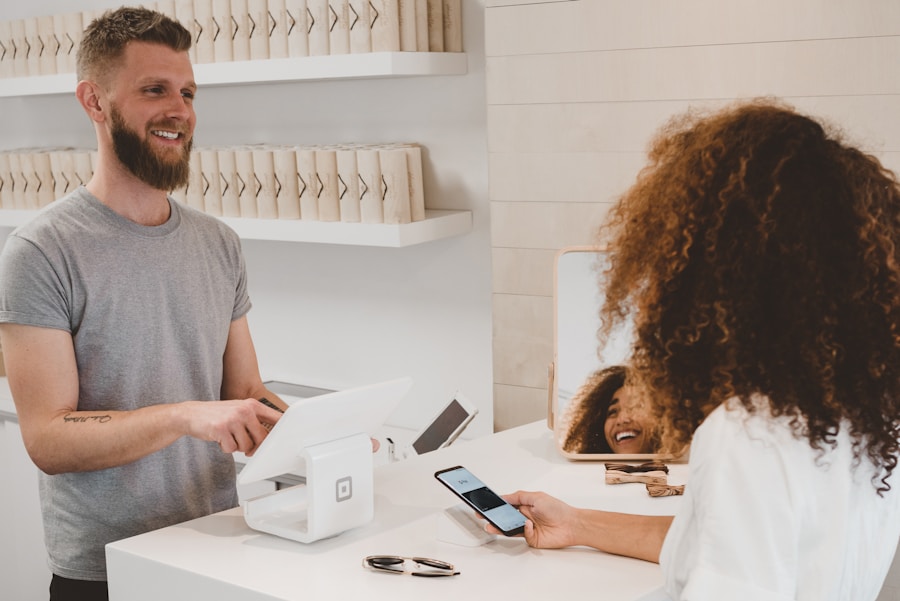 Customer completing a purchase at a retail checkout terminal.